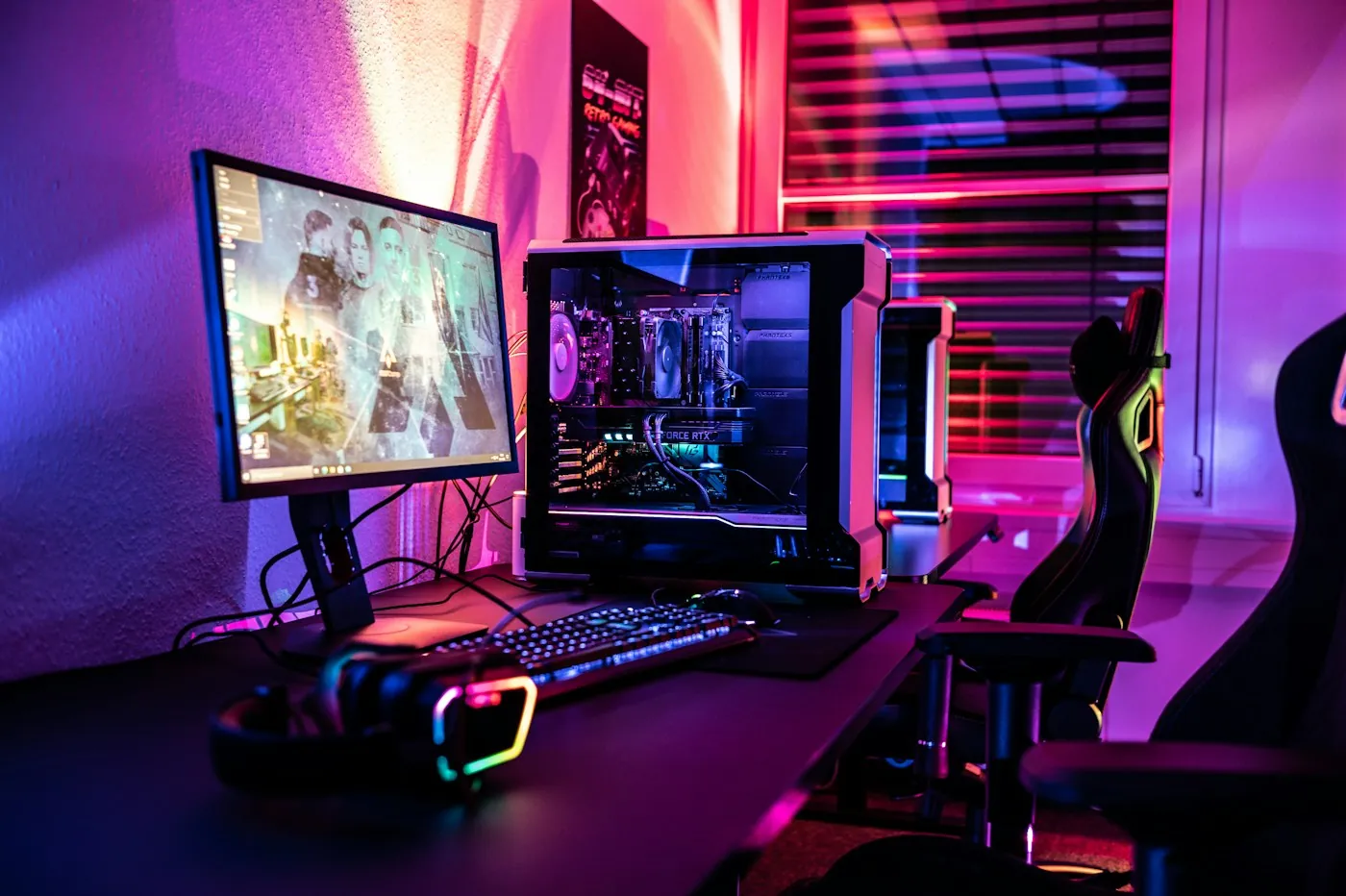 A gaming PC and monitor in a colourful home setup